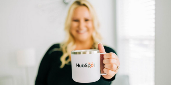 HubSpot Salesforce Integration Expert, Lauren Ryan, Holding HubSpot Mug
