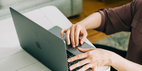 person on laptop navigating the HubSpot Salesforce integration